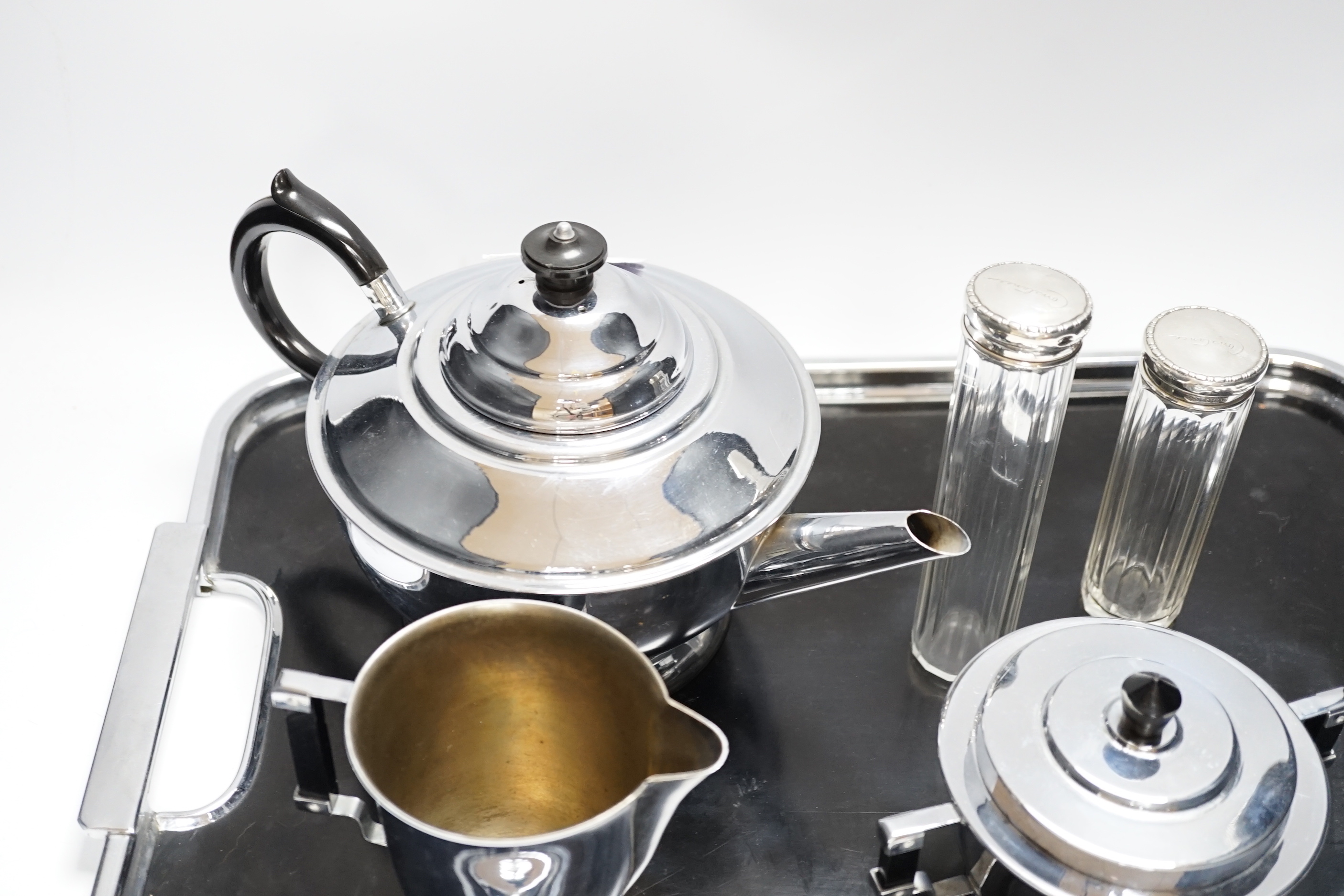 An Art Deco style plated teaset and tray and two silver jars